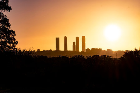 Golden sunrise over Madrid's financial districtの写真素材