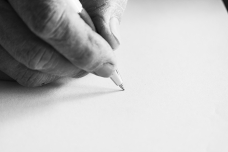 Writing on white paperの写真素材