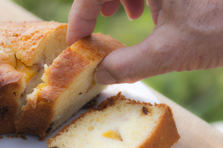 Cake with peach and dried fruit