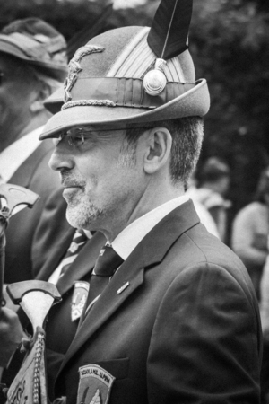 An old italian alpine military man is thinking and remembering past times during the parade of italian alpine military corps happened in Pordenone (Italy) - may 2014 - B&W Old film versionのeditorial素材