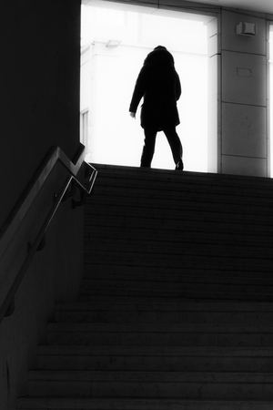 Unknown man at the top of dark stairsの写真素材
