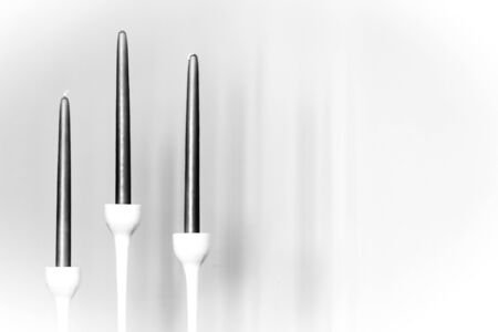 Three candles in black and whiteの写真素材