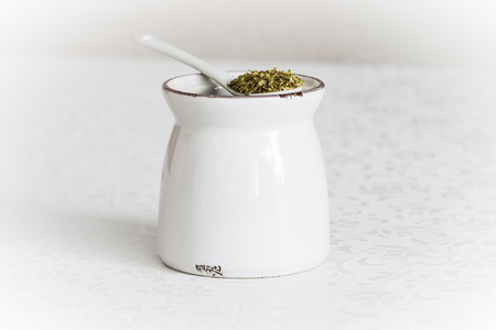 Origan on ceramic spoonの写真素材