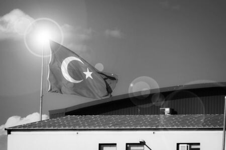 Turkish flag on building's roof - black and white imageの写真素材