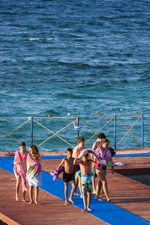 Children walking on the pierのeditorial素材