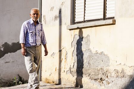 Old turkish man is walking