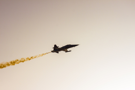 Military airplane in backlightの写真素材