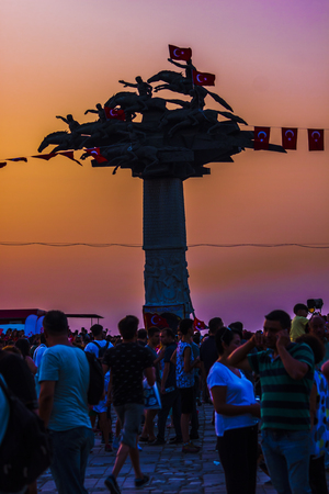 Crowd under the "Tree of Republic" monument in sunset in Izmirのeditorial素材