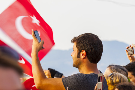 People recording video with smartphone at turkish public eventのeditorial素材