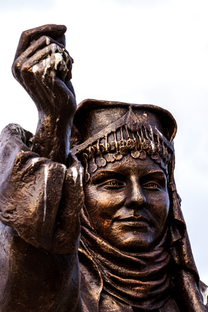 Close-up view on a bronze statue of a woman in Izmir (Turkey) - photographyの写真素材