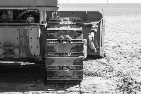 Close-up view on a industrial machine on the beach - photographyの写真素材