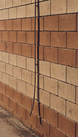 wall with particular pipe at sunsetの写真素材