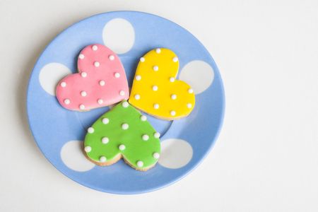 Pink, Green and Yellow polkadot heart shaped cookiesの写真素材