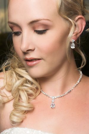 Beautiful Blond bride wearing diamond jeweleryの写真素材