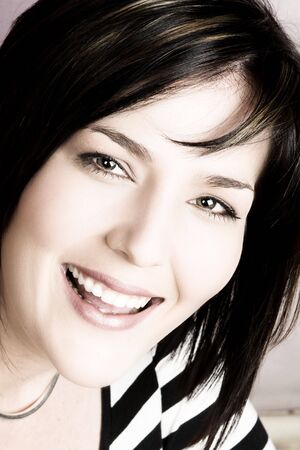 Beautiful brunette female on a pink backgroundの写真素材