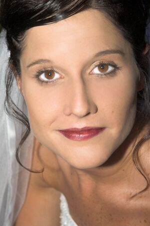 Beautiful brunette bride with hazel eyes, close upの写真素材