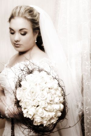 Beautiful, classical style bride wearing a veilの写真素材