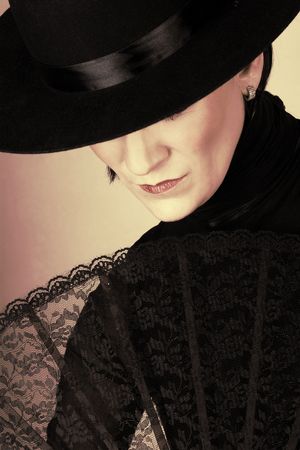 Spanish Dancer in a black costume with hat and accessoriesの写真素材