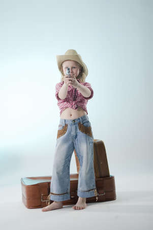 cowgirl shooting with gunの写真素材