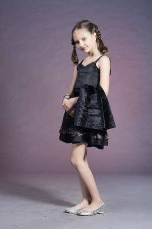 Little preteen nice smiling girl posing in studioの写真素材