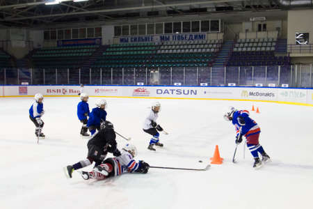 MINSK, BELARUS SEPTEMBER 30: Children boys playing hockey on ice in the Yunost\' stadium, 30 September 2014 in Minsk, Belarus.のeditorial素材