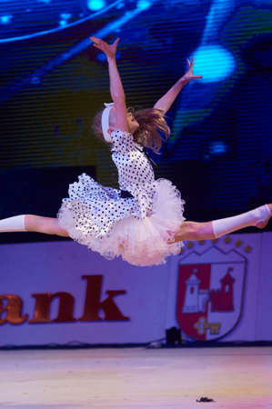 MINSK, BELARUS DECEMBER 05: unidentified gymnast from ' Belyavskaya Valeria' participate with 'Where the childhood leaves Dynamo'  in 'Baby Cup - BSB Bank' children's competitions in gymnastics , 05 December 2015 in Minsk, Belarus.のeditorial素材