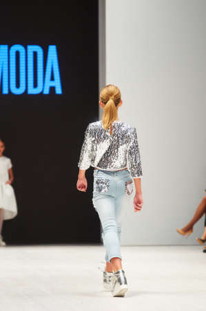 MINSK-OCTOBER 29: An unidentified girl wears ARTMODA collection at the international exhibition of the fashion industry, Kid's fashion day during Belarus Fashion Week on October 29, 2017 in Minsk, Belarus.のeditorial素材
