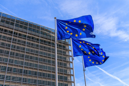 Brussels, Belgium - August 11, 2018: Flags of the European Union in front of the Berlaymont building...