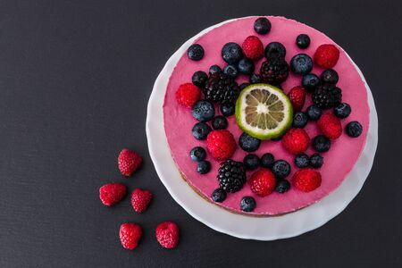 Raw vegan cake, homemade with berry and lemon.の写真素材