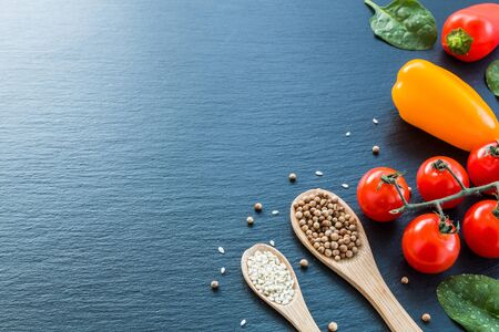 Fresh vegetables and spices from above with negative space for text and graphics.の写真素材