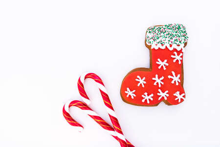 Gingerbread cookie and  candy cane on white background.の写真素材