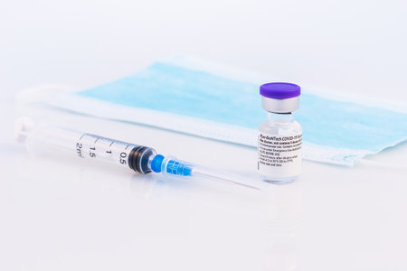 Brasov, Romania - February 21, 2021: Pfizer-BioNTech Covid-19 vaccine on a white background.のeditorial素材