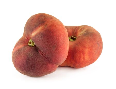 Saturn peaches - Two flat donut peaches isolated on a white backgroundの写真素材