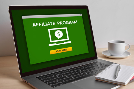 Affiliate program concept on modern laptop computer screen on wooden table. All screen content is designed by me. の写真素材