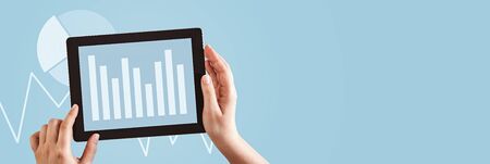 Blue charts and graphs. Analysis chart graph concept. Hands using tablet computer analyzing business...