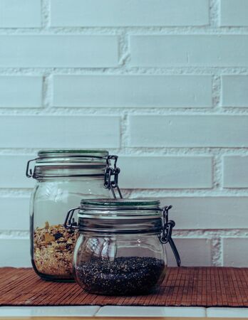 seeds and muesli in hermetic glass jarsの写真素材