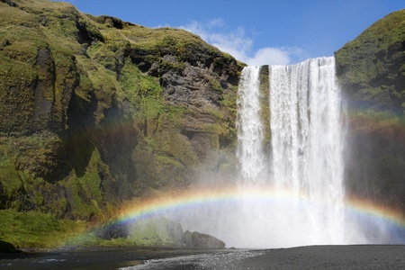 Rainbow at the waterfall Skogafoss in Iceland