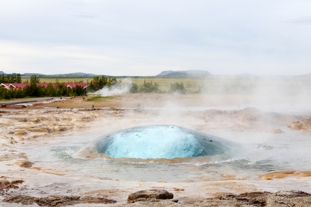 The Strokkur geyser in Iceland about to eruptの写真素材