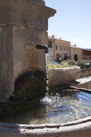 old french watertap with crystal clear waterの写真素材