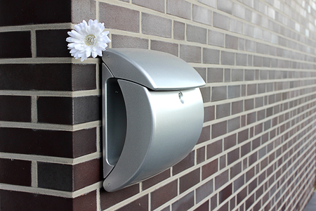 Inbox with a flower on the wallの写真素材