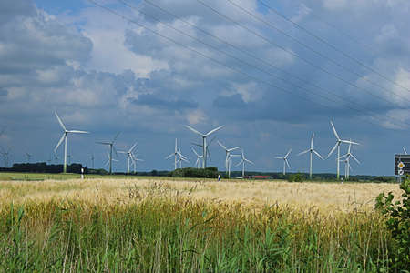 Wind generators along the road before the storm
