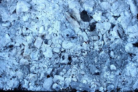 The backdrop of charred white charcoal extinguished the fireの写真素材