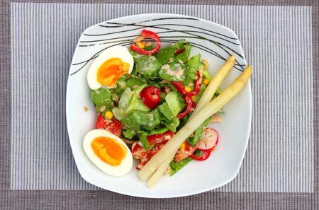 Breakfast salad with fresh leaves, vegetables and beansの写真素材