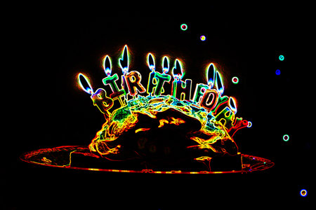 Birthday cake with candles in the form of a skull on a black backgroundの写真素材