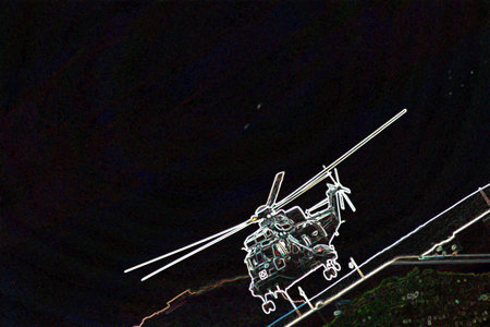 Helicopter in the night sky, closeup of photo.の写真素材