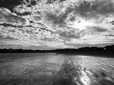 Weymouth beach with clouds in black and white. Dorset England