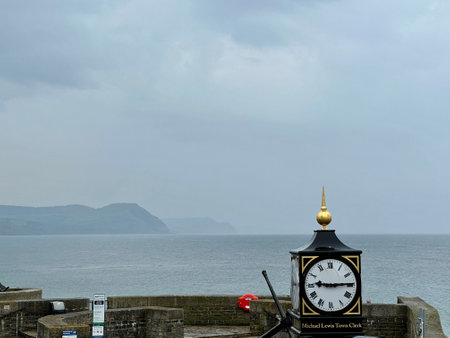 Clock tower on the seafront promenade in Lyme Regis Dorset Englandの写真素材