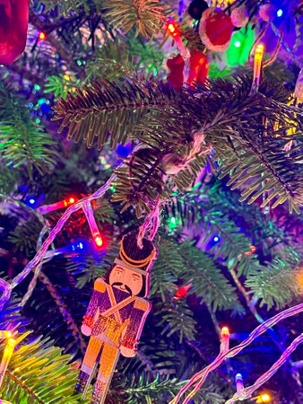 Christmas tree decoration with lights and ornaments, closeup of photoの写真素材