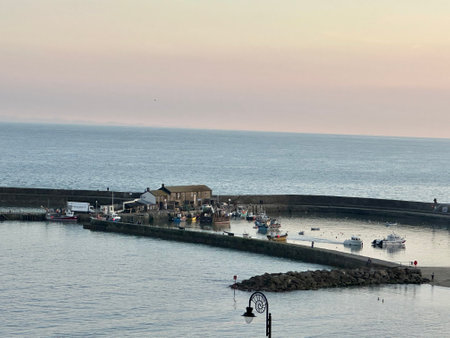 Sunset at the harbour of Lyme Regis Dorset England