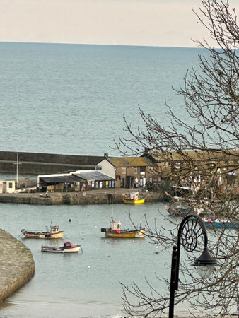 Fishing boats in the harbour of Lyme Regis dorset Englandの写真素材